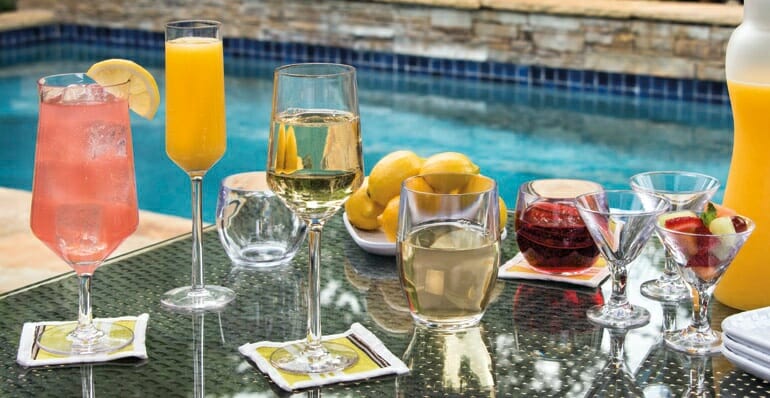 plastic-vs-glass-drinkware-poolside-patio.jpg